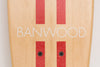 Banwood Skateboard - Natuurkleurig skateboard met donkerrode strepen voor kinderen vanaf 3 jaar - Verkrijgbaar bij Littlefashionaddict.com