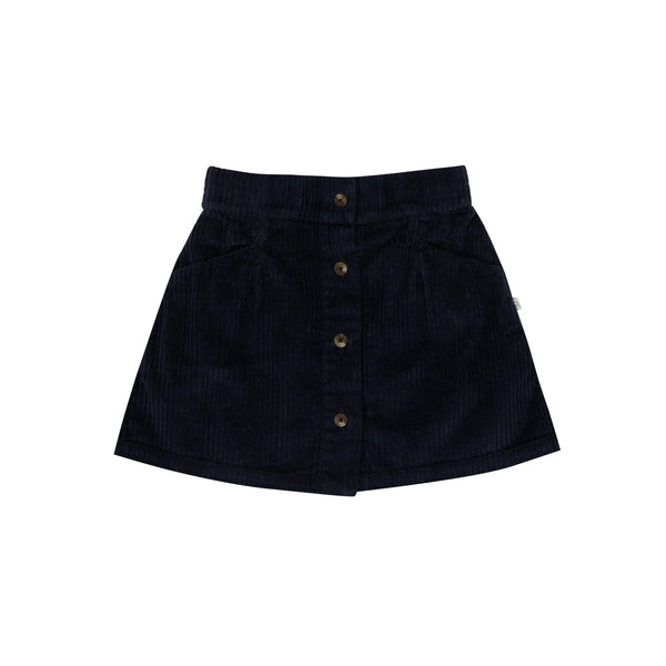 Jenest Bibi Skirt Navy Blue – Donkerblauw ribfluwelen meisjesrokje met knoopsluiting en steekzakken, verkrijgbaar bij Little Fashion Addict
