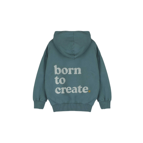 Detail van de Born to Create-print op de petrolgroene Jenest hoodie | Verkrijgbaar bij Little Fashion Addict