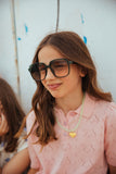Pointelle Polo Petal van Wander & Wonder in lichtroze met textuur en pofmouwen. | Meisjespolo | Verkrijgbaar bij Little Fashion Addict