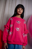 Donkerroze meisjessweater met glinsterende strikjes van Daily Brat – City Notes Collectie | Ontdek Daily Brat bij Little Fashion Addict
