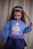 Lichtpaarse meisjessweater Mary Puppins met poedelprint en hartjesbril van Daily Brat – City Notes collectie | Ontdek Daily Brat bij Little Fashion Addict
