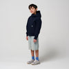 Gosoaky Blue Bird regenjas in donkerblauw voor jongens en meisjes -  Verkrijgbaar bij Little Fashion Addict