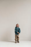 Jongen met petrolgroene hoodie van Jenest en opvallende rugprint | Verkrijgbaar bij Little Fashion Addict