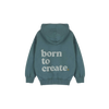 Detail van de Born to Create-print op de petrolgroene Jenest hoodie | Verkrijgbaar bij Little Fashion Addict