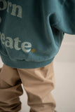 Jongen met petrolgroene hoodie van Jenest en opvallende rugprint | Verkrijgbaar bij Little Fashion Addict