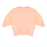 Pippa Sweater Peach Orange van Jenest – abrikooskleurige oversized meisjes sweater met bloemenprint op de rug | Ontdek Jenest bij Little Fashion Addict