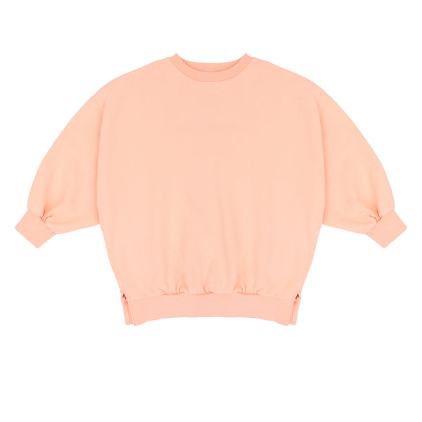 Pippa Sweater Peach Orange van Jenest – abrikooskleurige oversized meisjes sweater met bloemenprint op de rug | Ontdek Jenest bij Little Fashion Addict