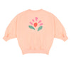 Pippa Sweater Peach Orange van Jenest – abrikooskleurige oversized meisjes sweater met bloemenprint op de rug | Ontdek Jenest bij Little Fashion Addict