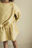 Lichtgeel rokje met elastische tailleband van Jenest | Bird Skirt Faded Yellow van Jenest | Verkrijgbaar bij Little Fashion Addict 