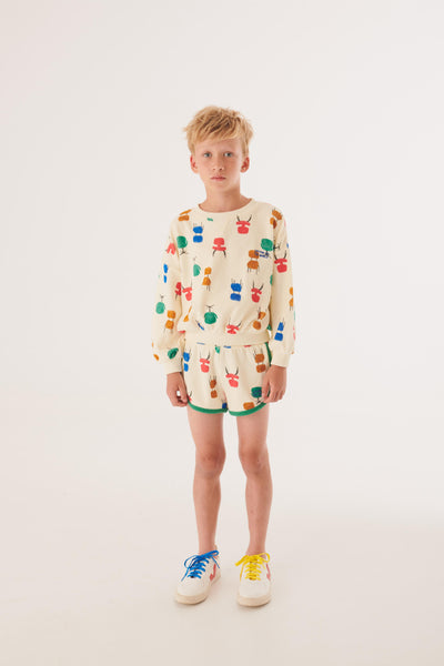 Osaka Sweat - Melkkleurig biologisch katoenen sweatshirt voor jongens met kleurrijke stoelenprint | Osaka Sweat van Letter To The World | Verkrijgbaar bij Little Fashion Addict