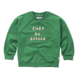 Donkergroene sweater met raglanmouwen en 'Chef du Burger' opdruk voor jongens uit Venice Beach Baby collectie van Sproet & Sprout. Verkrijgbaar bij Little Fashion Addict