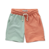 Colourblock sweatshort in oranje en muntgroen voor jongens van Sproet & Sprout uit de Champions League of Fun Collectie