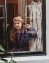 Jurk in zachte terry stof met bruine en donkerblauwe strepen van Sproet & Sprout | Verkrijgbaar bij Little Fashion Addict