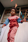 Comfortabele sweater met colourblock design in roze, terracotta en blauw van Sproet & Sprout.