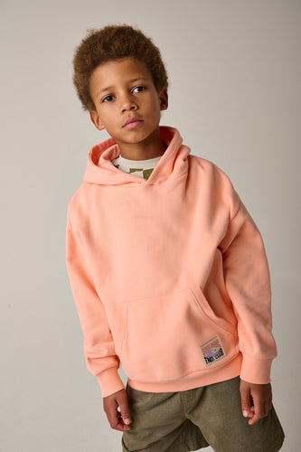 Koraaloranje unisex hoodie met kap van Tumble ’n Dry | Salty Hoodie Sweater in apricot blush van Tumble 'n Dry - verkrijgbaar bij Little Fashion Addict
