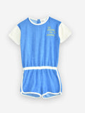 Little Fashion Addict - Maison Tadaboum – Valenia Jumpsuit - Voor meisjes - Korte blauwe jumpsuit in badstof met korte witte mouwen - Meisjesmode - Collectie: Bistrot Tadaboum - verkrijgbaar bij Littlefashionaddict.com